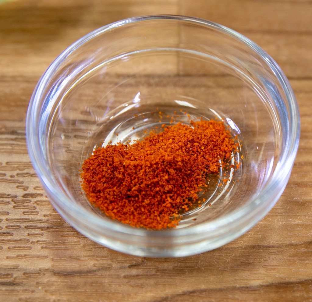 a glass bowl holding a small amount of cayenne powderBy Alabama Extension - https://www.flickr.com/photos/184594136@N08/50594877991/, CC0, https://commons.wikimedia.org/w/index.php?curid=102658519
